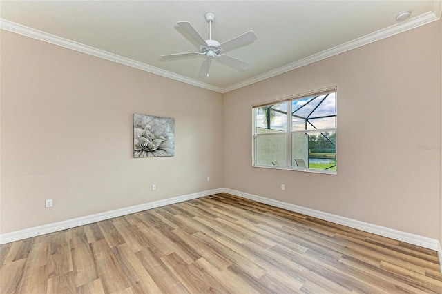 spare room with crown molding, ceiling fan, and light hardwood / wood-style floors