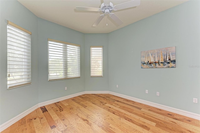 spare room featuring ceiling fan and light wood-type flooring