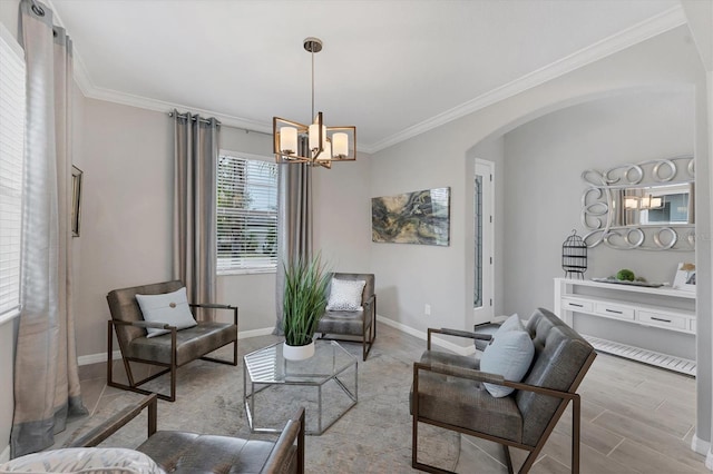 living room featuring crown molding and a notable chandelier