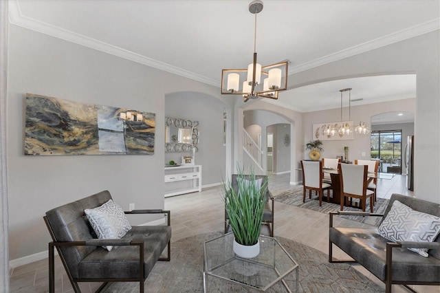 living room featuring crown molding and an inviting chandelier