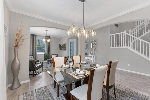 dining room with an inviting chandelier and crown molding