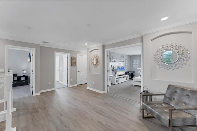 foyer with wood-type flooring and ornamental molding