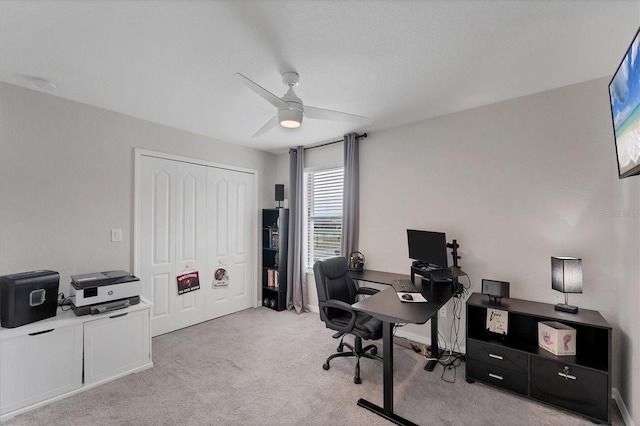 office with ceiling fan and light colored carpet