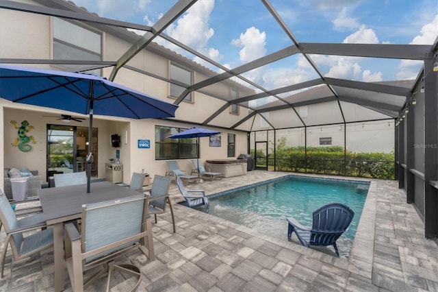 view of pool with a patio area, a lanai, a hot tub, and ceiling fan