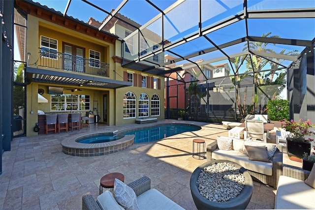 view of pool featuring outdoor lounge area, ceiling fan, a lanai, an in ground hot tub, and a patio