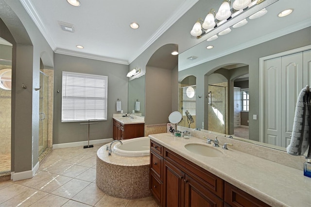 bathroom featuring tile patterned floors, vanity, ornamental molding, and plus walk in shower