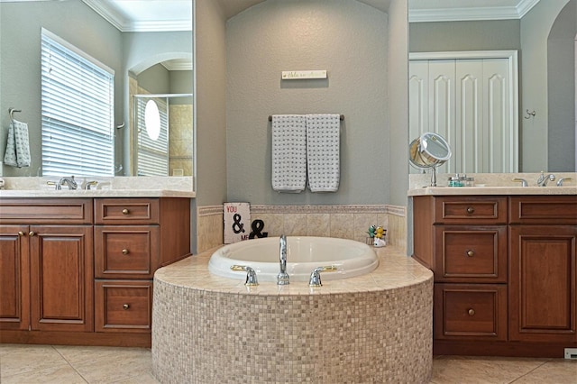 bathroom featuring plus walk in shower, vanity, tile patterned floors, and crown molding