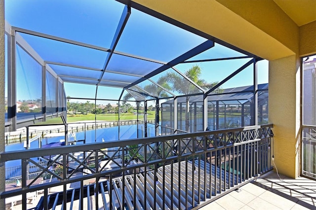 view of swimming pool with a boat dock and glass enclosure