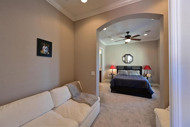 bedroom featuring light colored carpet, ceiling fan, and ornamental molding