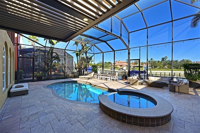 view of pool featuring a lanai, a patio area, and an in ground hot tub