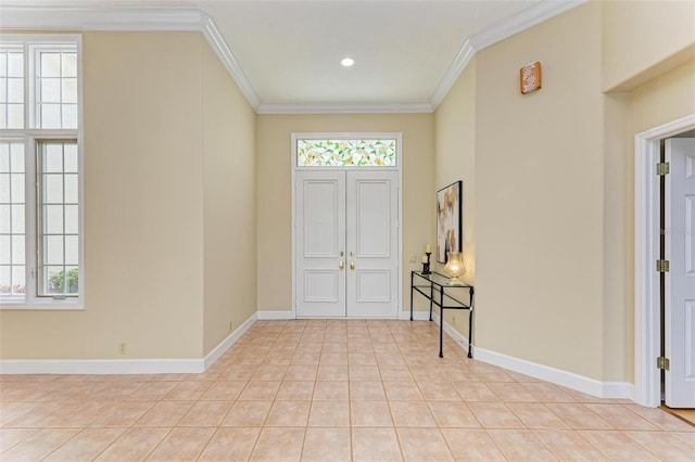 entrance foyer with light tile patterned floors and ornamental molding