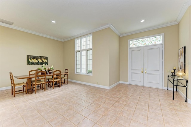 foyer featuring ornamental molding and light tile patterned floors