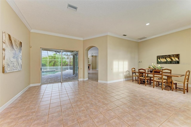 interior space with light tile patterned floors, crown molding, and a textured ceiling