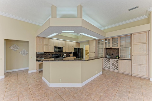 kitchen with ornamental molding, dark stone countertops, light tile patterned floors, and black appliances