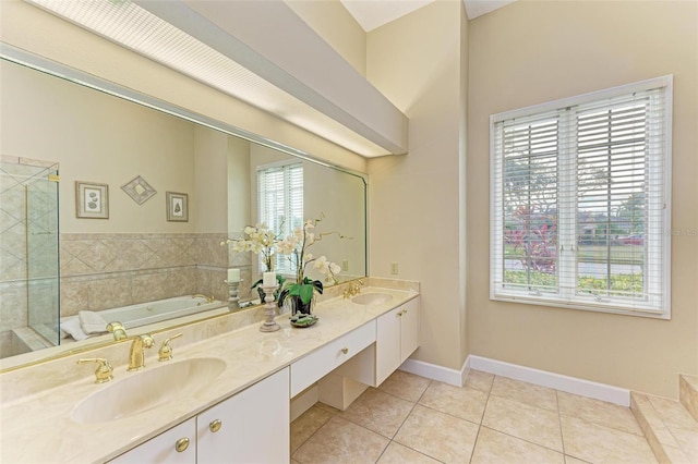 bathroom with tile patterned flooring, vanity, and shower with separate bathtub