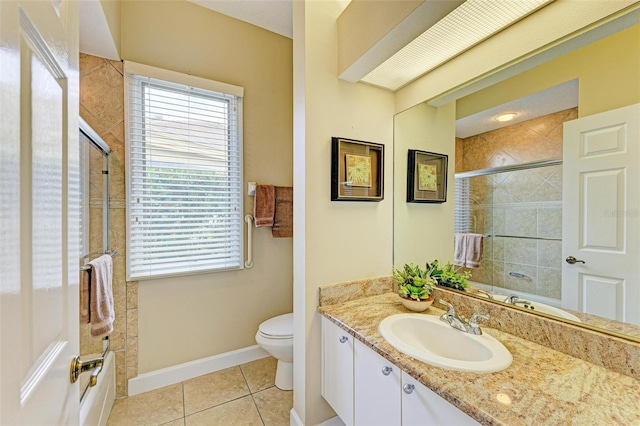 bathroom featuring vanity, tile patterned flooring, and toilet