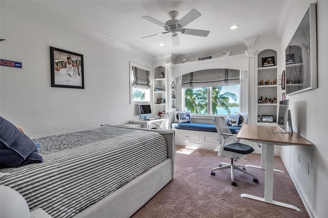 carpeted bedroom featuring ceiling fan and ornamental molding