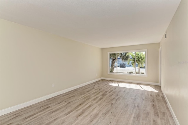 empty room featuring light hardwood / wood-style floors