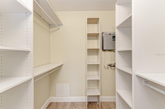 walk in closet featuring light wood-type flooring