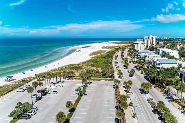 bird's eye view featuring a beach view and a water view