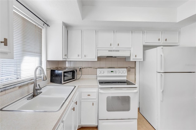 kitchen featuring sink, white cabinetry, white appliances, backsplash, and ventilation hood