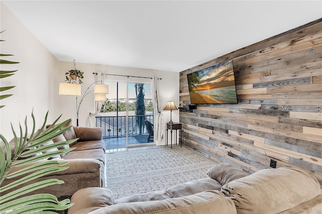 living room featuring wood walls