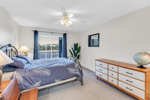 bedroom with ceiling fan and light carpet