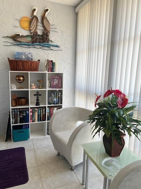 sitting room featuring tile patterned floors