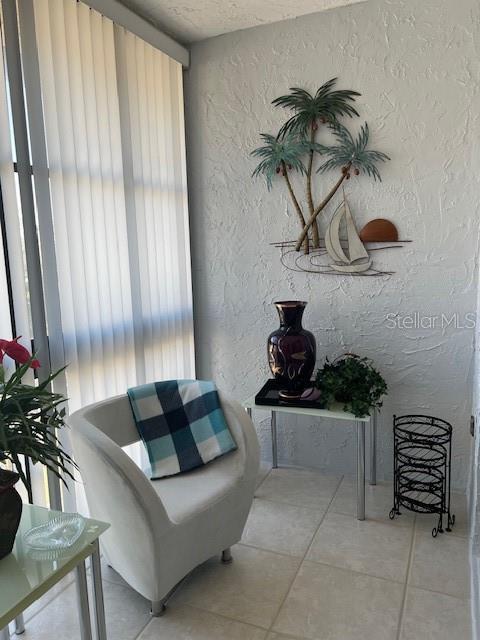 living area featuring light tile patterned flooring