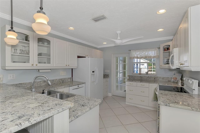 kitchen featuring sink, white cabinetry, hanging light fixtures, ornamental molding, and white appliances