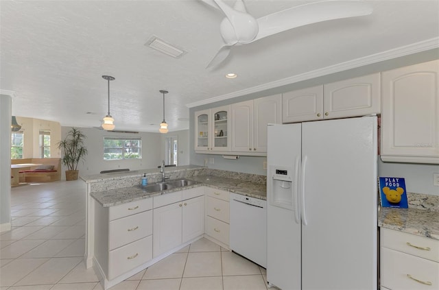 kitchen with light tile patterned flooring, pendant lighting, white cabinetry, sink, and white appliances