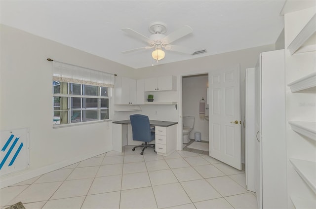 tiled office featuring ceiling fan