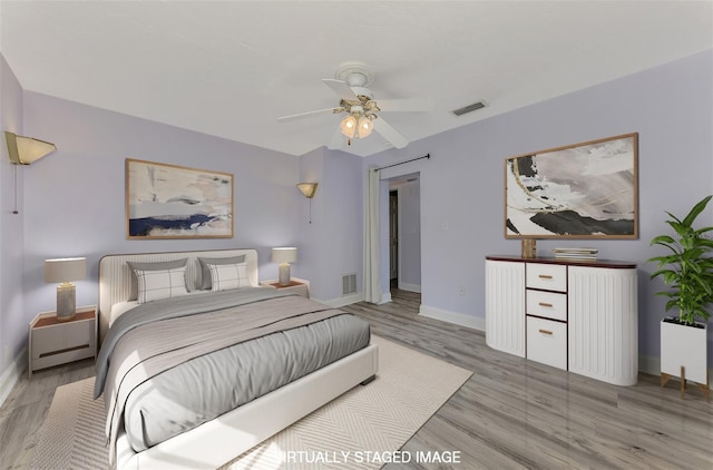 bedroom featuring ceiling fan and light wood-type flooring