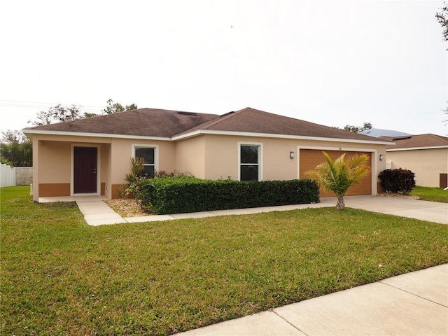 single story home featuring a front yard and a garage