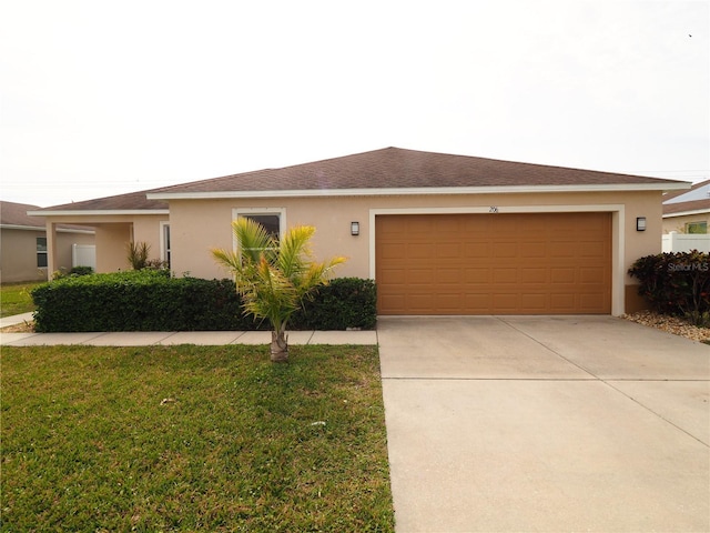 view of front of house with a garage and a front yard