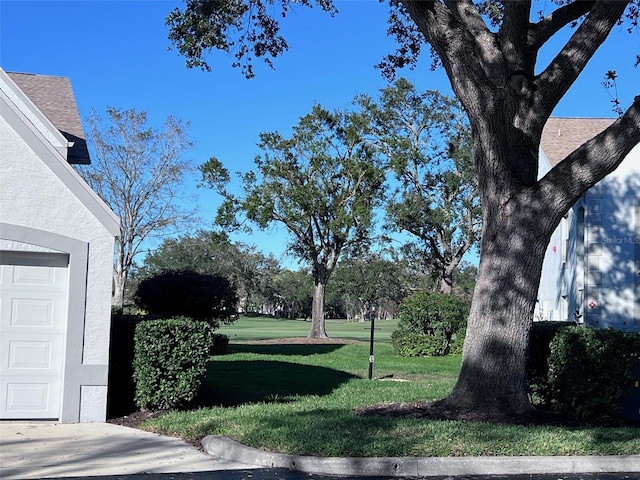 view of yard featuring a garage