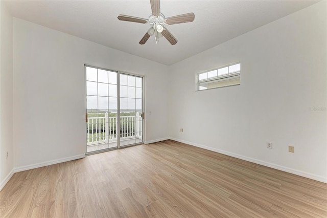 unfurnished room with ceiling fan, light hardwood / wood-style floors, and a wealth of natural light