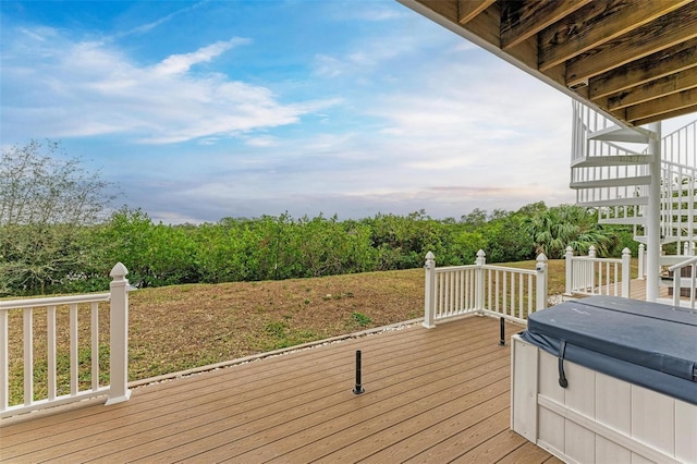 deck featuring a hot tub