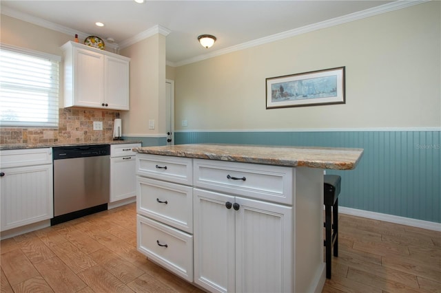 kitchen with dishwasher, white cabinets, light hardwood / wood-style flooring, and ornamental molding