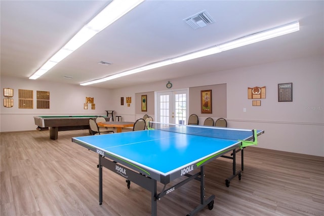 recreation room with french doors, light wood-type flooring, and pool table