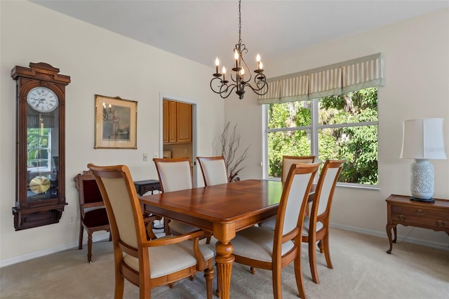 carpeted dining area with a chandelier and a wealth of natural light