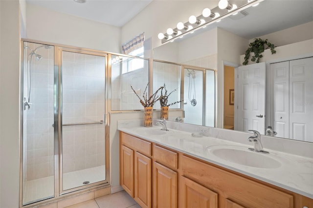 bathroom featuring toilet, tile patterned flooring, walk in shower, and vanity