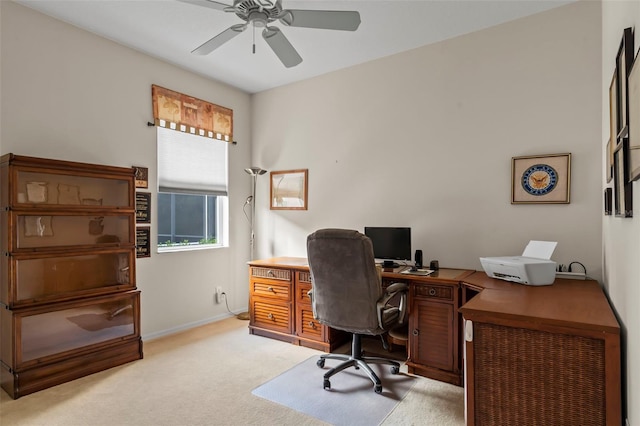 carpeted home office with ceiling fan