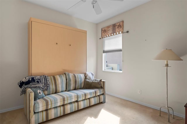 carpeted living room featuring ceiling fan