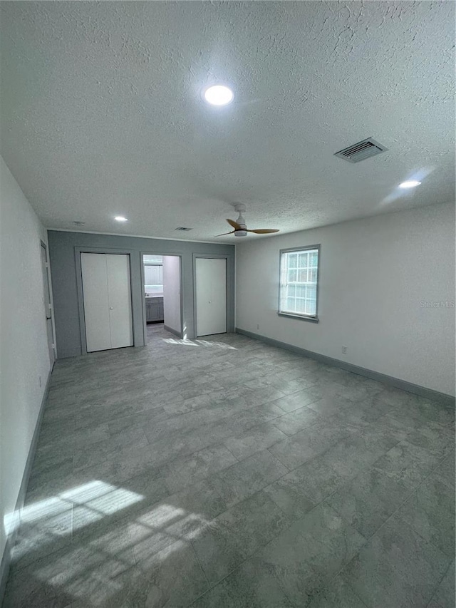 spare room with ceiling fan