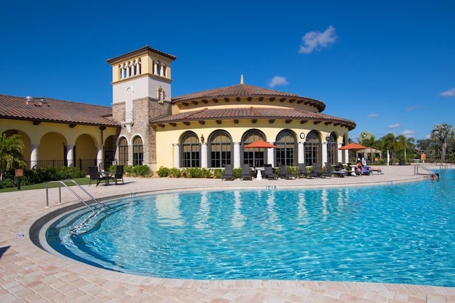 view of swimming pool with a patio area