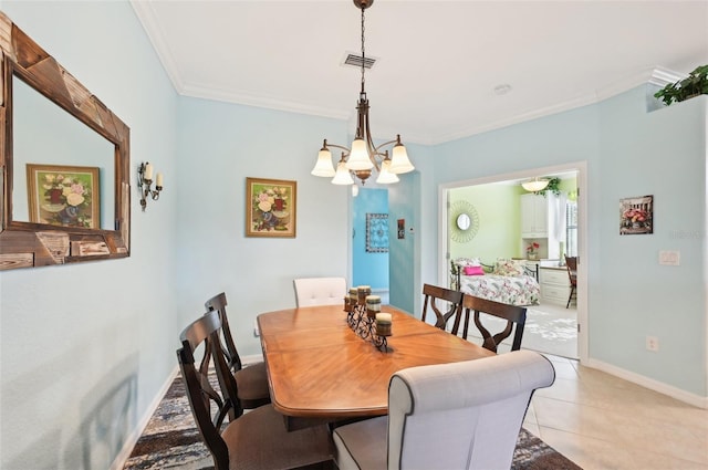 dining room featuring a notable chandelier, light tile patterned flooring, and ornamental molding