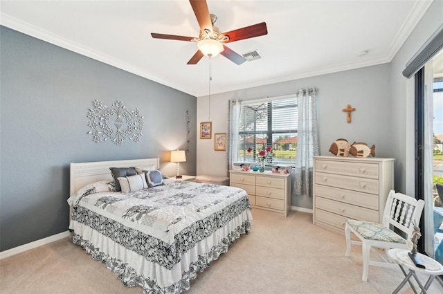 carpeted bedroom with ceiling fan and crown molding