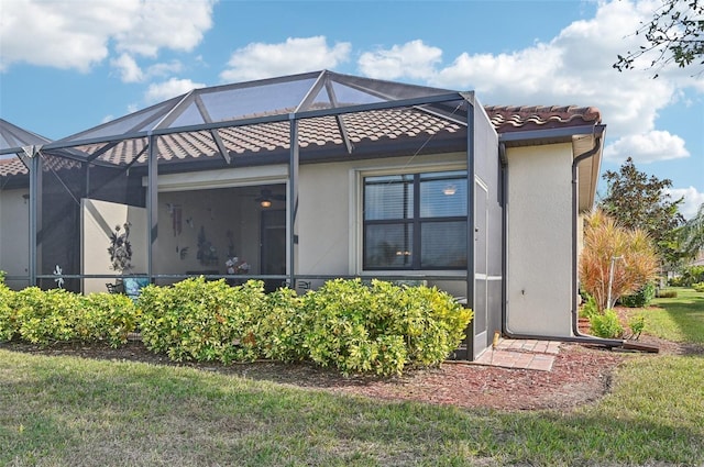 rear view of property with a lanai