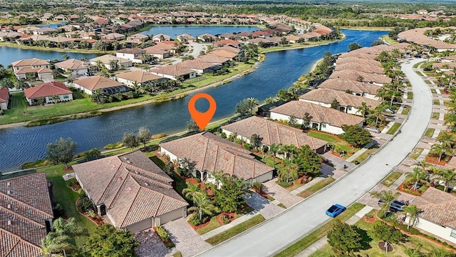 birds eye view of property featuring a water view